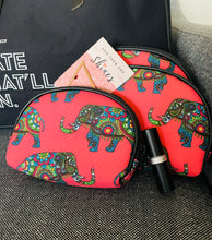 Load image into Gallery viewer, Especially for You Delta Sigma Theta inspired gift.  Black canvas tote bag with 3-piece elephant cosmetic bag and rich, red matte lipstick and gold triangle hair clip