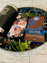 Load image into Gallery viewer, Black 20 oz. ENJOY LIFE tumbler,  black floral Journal with matching pen, W. African chocolate bars packed in a round decorative table tray
